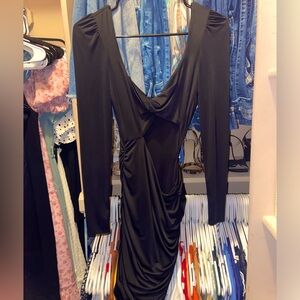 Tight black dress with an open side part